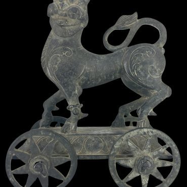 BRONZE YALI ON WHEELS