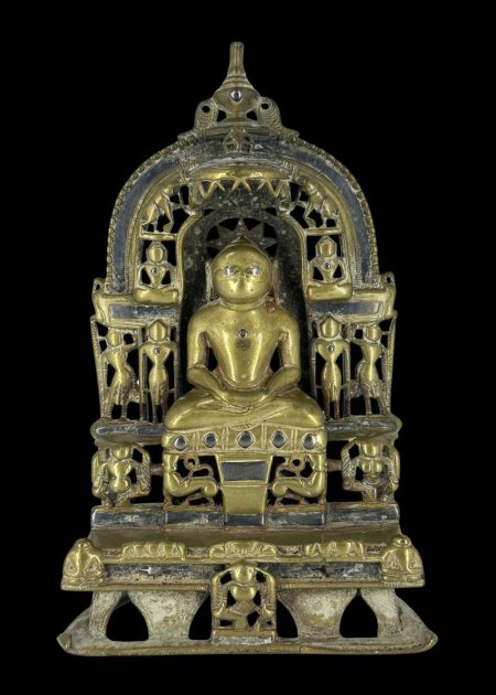 SEATED JINA UNDER ORNATE PRABHAVALI