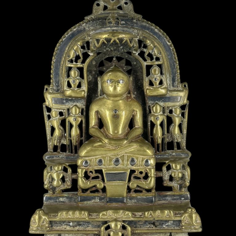 SEATED JINA UNDER ORNATE PRABHAVALI