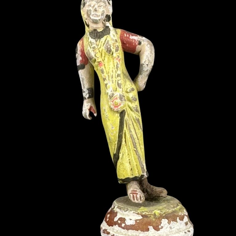 STANDING VILLAGE WOMAN