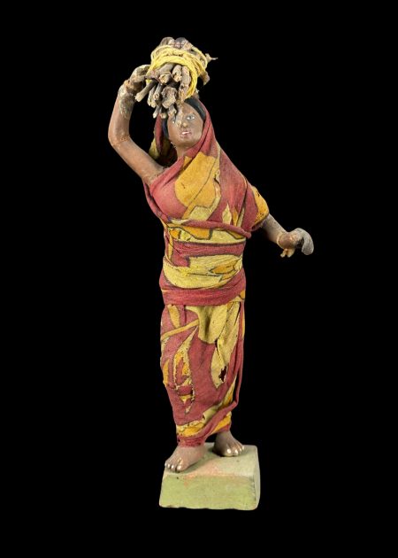 VILLAGE WOMAN CARRYING FIREWOOD