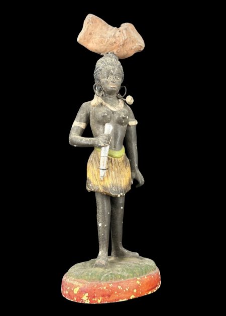 TRIBAL WOMAN CARRYING FIREWOOD