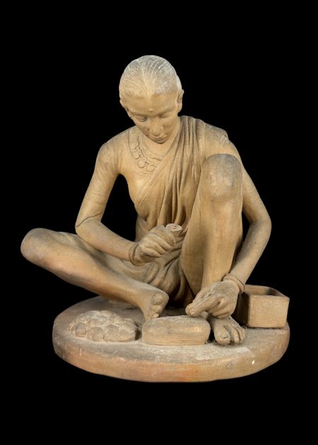 TRADITIONAL WOMAN MAKING SWEETS