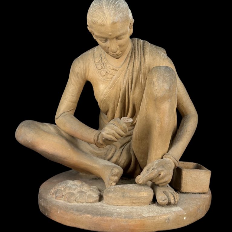 TRADITIONAL WOMAN MAKING SWEETS