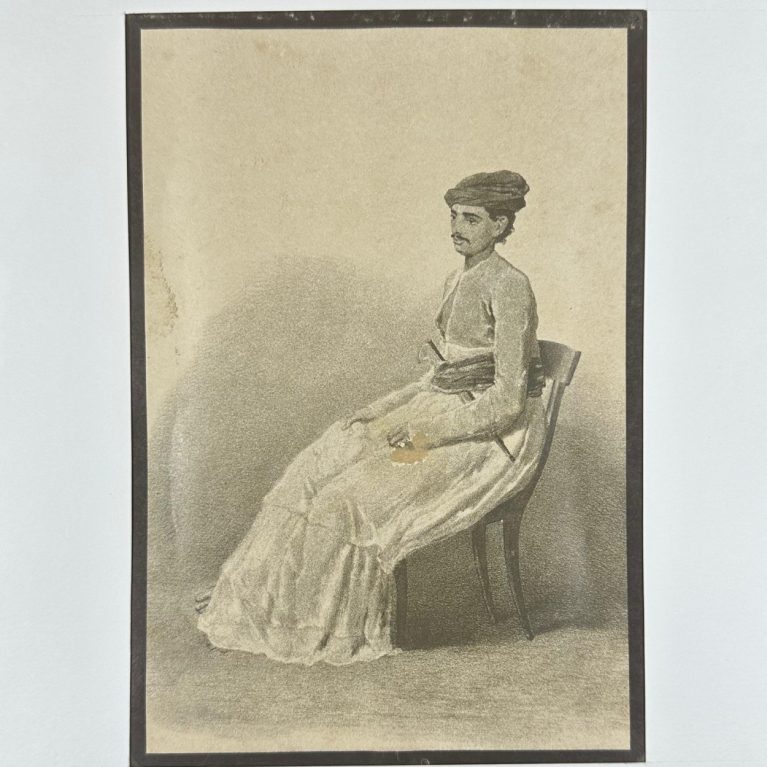 A SEATED INDIAN GENTLEMAN