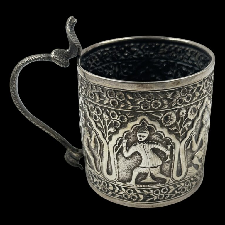 SILVER MUG WITH FIGURAL RELIEF