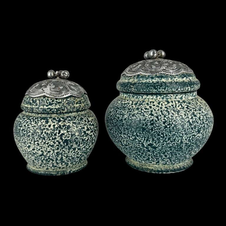 PAIR OF SILVER-CAPPED DECORATIVE JARS