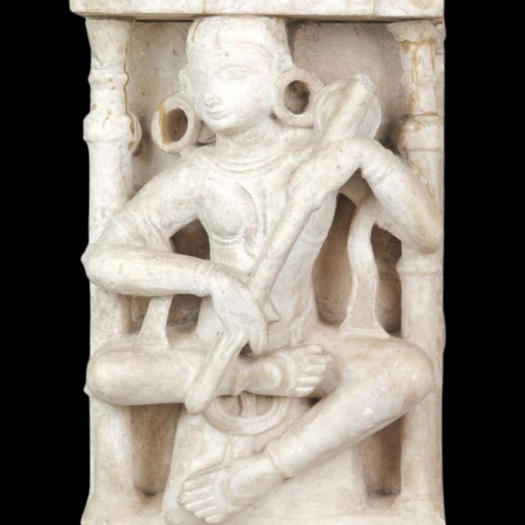SEATED DEITY SCULPTURE WITH ARCHITECTURAL FRAME