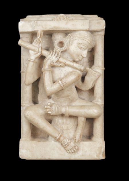 MARBLE SCULPTURE OF FLUTE PLAYER IN ARCHITECTURAL NICHE