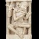 MARBLE SCULPTURE OF FLUTE PLAYER IN ARCHITECTURAL NICHE