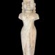 CLASSICAL STONE FIGURE WITH DRAPED GARMENT AND COILED HAIRSTYLE