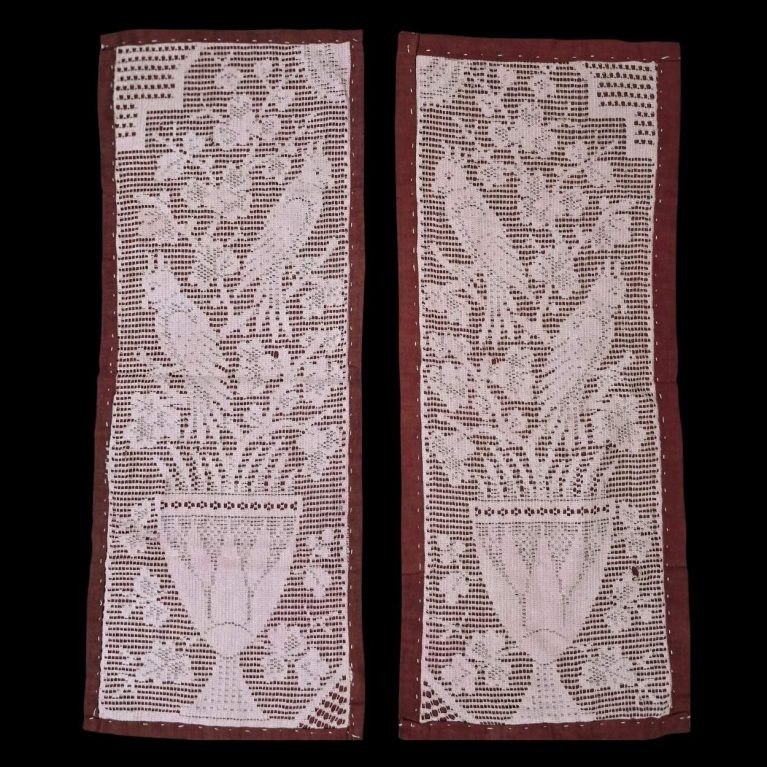 LACE PICHWAI BEAUTIFULLY FEATURES A DESIGN OF BIRDS AND A FLOWER POT